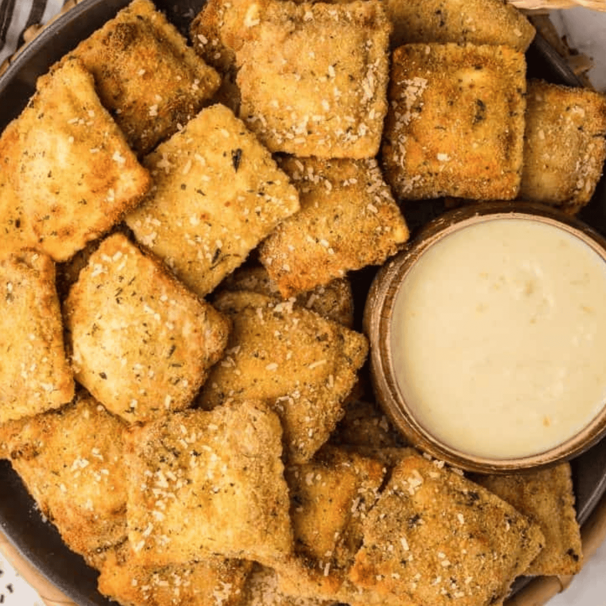 Creamy Alfredo Dipping Sauce served with breadsticks, perfect for dipping and adding rich, cheesy flavor.