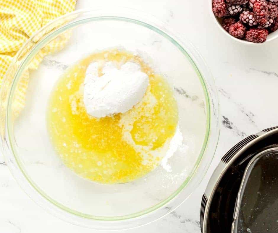 In a large mixing bowl, mix together than butter, sugar, and soda.