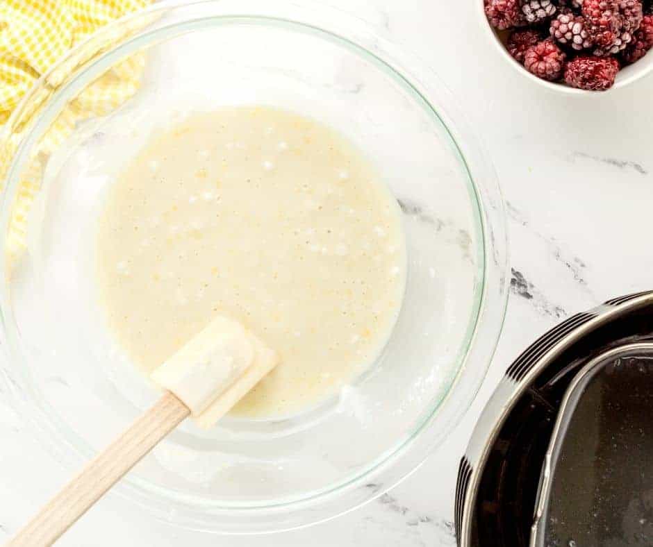 Slowly fold the flour into the mixture.