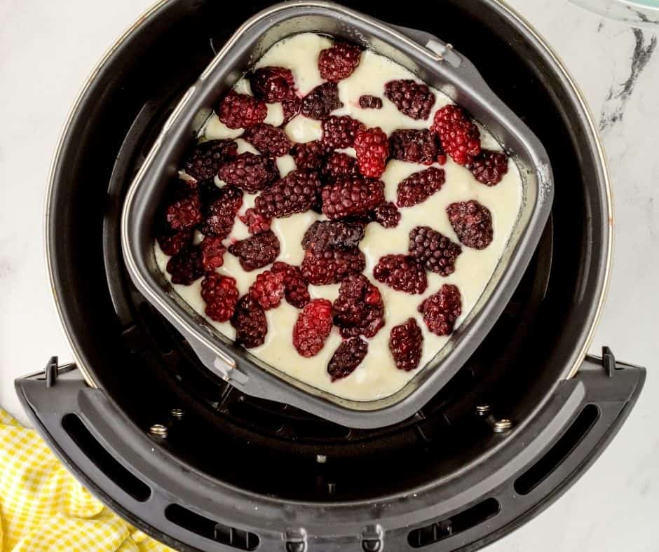 Add the blackberries on top of the cobbler.