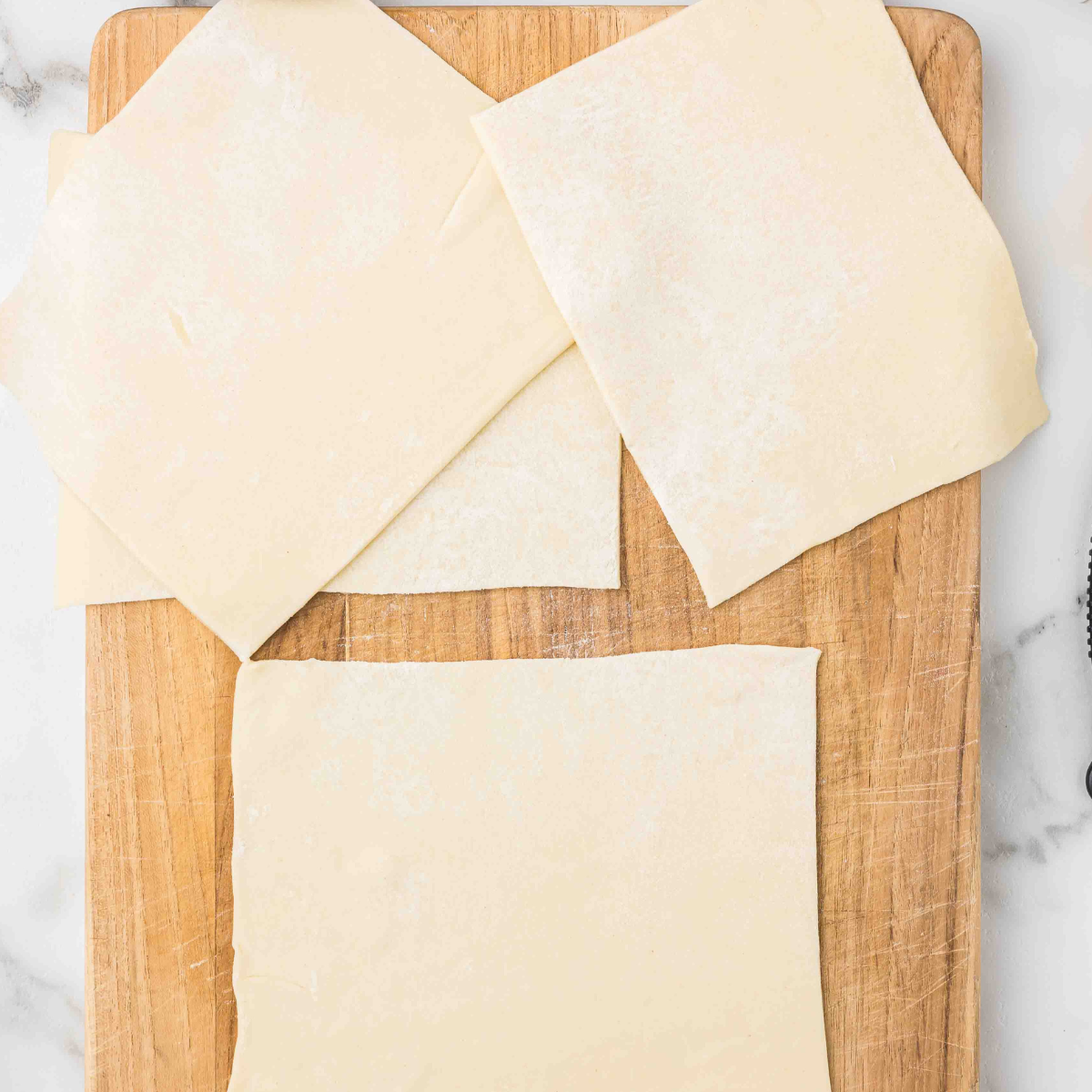 Ingredients needed for Air Fryer Ham and Cheese Twists on kitchen table.