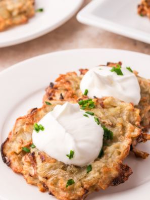 Golden, shatteringly crispy potato latkes with a fluffy center — no pot of splattering oil required. The moisture secret makes all the difference.