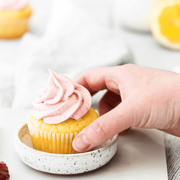 Golden, fluffy Air Fryer Lemon Cupcakes with bright lemon frosting on top.
