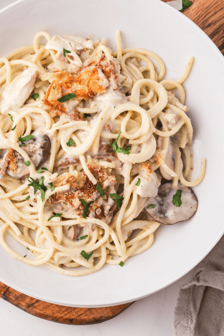 Homemade Air Fryer Turkey Tetrazzini served hot with creamy sauce, turkey chunks, spaghetti noodles, and crispy cheesy topping.