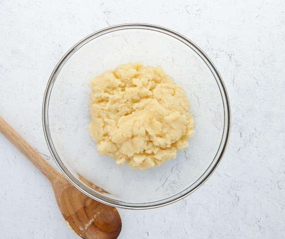 Cook dough mixture over medium heat, stirring until it forms a soft ball and a film forms on the pan.