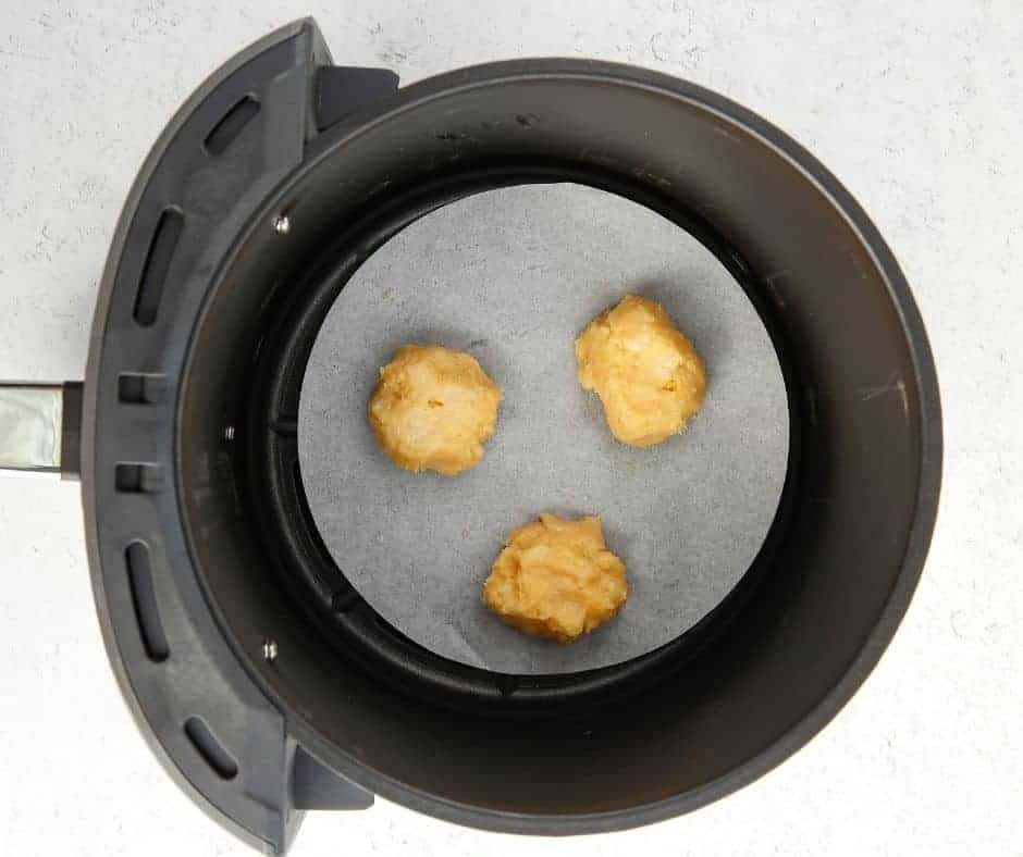 Bake cream puffs in air fryer for 14-16 minutes until golden, then poke holes and cool.