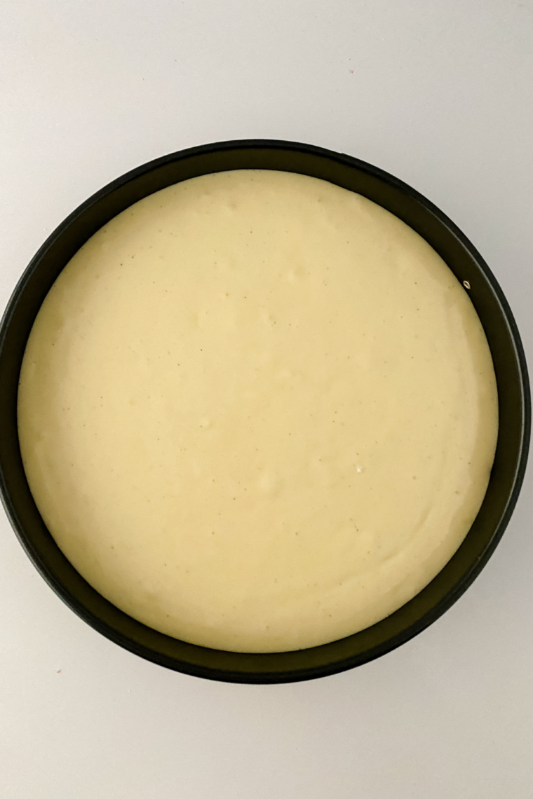 Cheesecake batter poured into crust prepared for water bath baking