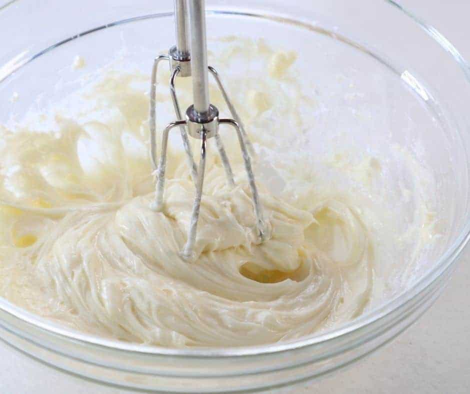 In a large mixing bowl or using a hand mixer, mix the room-temperature cream cheese and powdered sugar.
