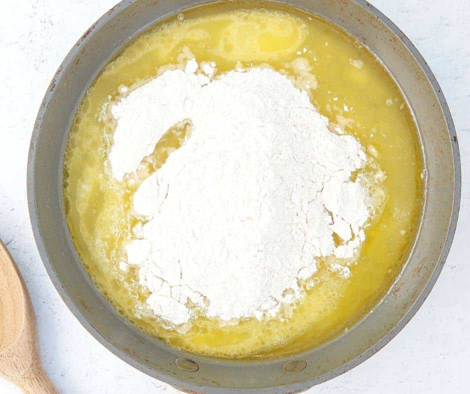 Preheat air fryer to 350°F and melt butter with water and salt in a saucepan. Stir in flour until smooth.
