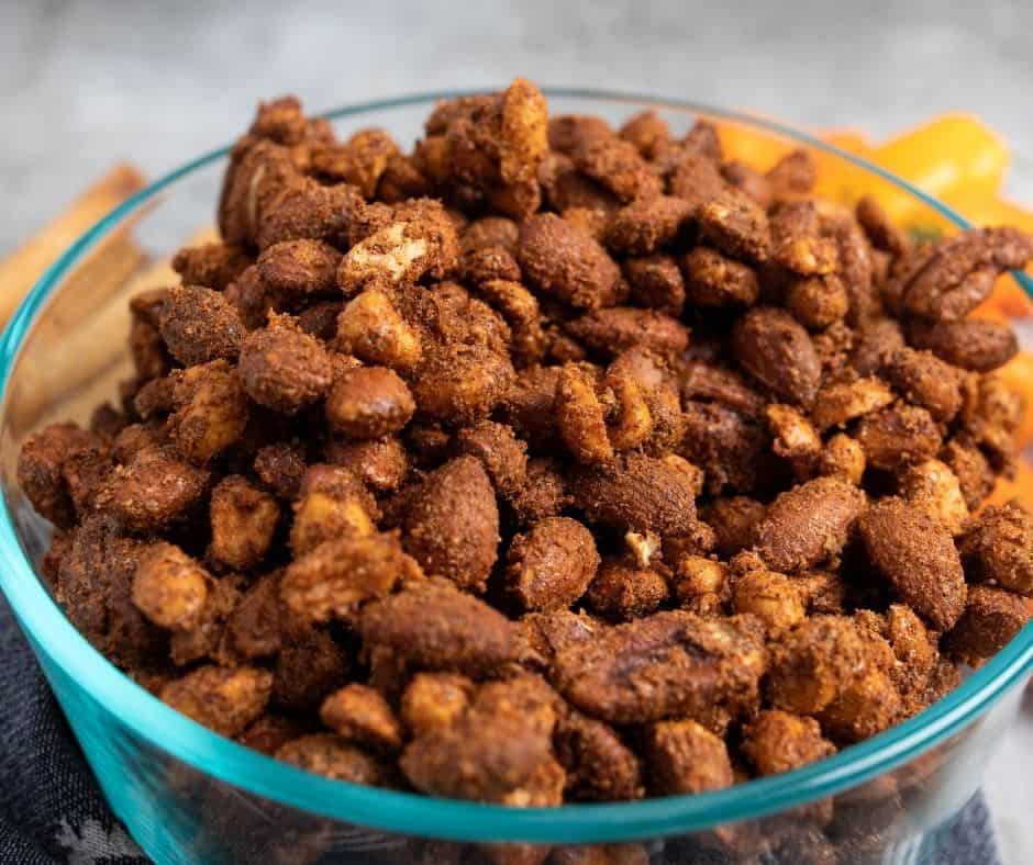 Air Fryer Barbecue Roasted Mixed Nuts with a smoky, sweet glaze, served in a bowl.