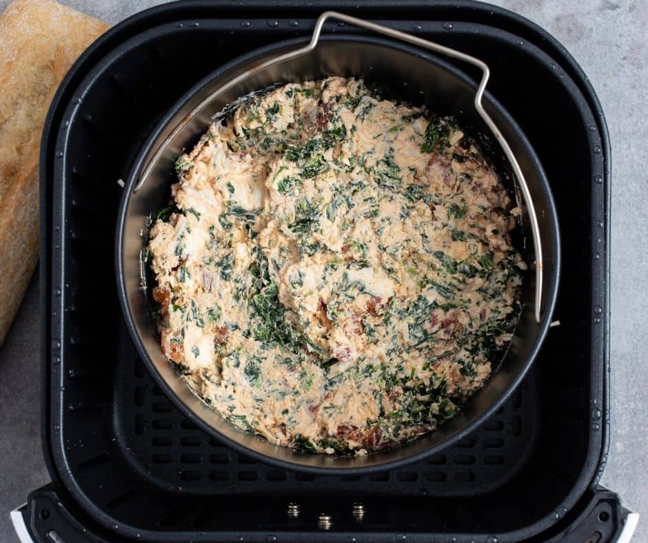 Image of the Dip Being Transferred to the Air Fryer Basket: Prepping the dip for air frying to golden, bubbly perfection.
