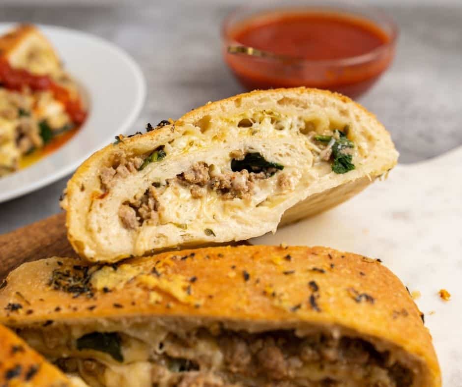 Air Fryer Cheesy Sausage Pizza Bread featuring savory sausage, gooey melted mozzarella, and a crispy crust, perfect as an appetizer or meal.