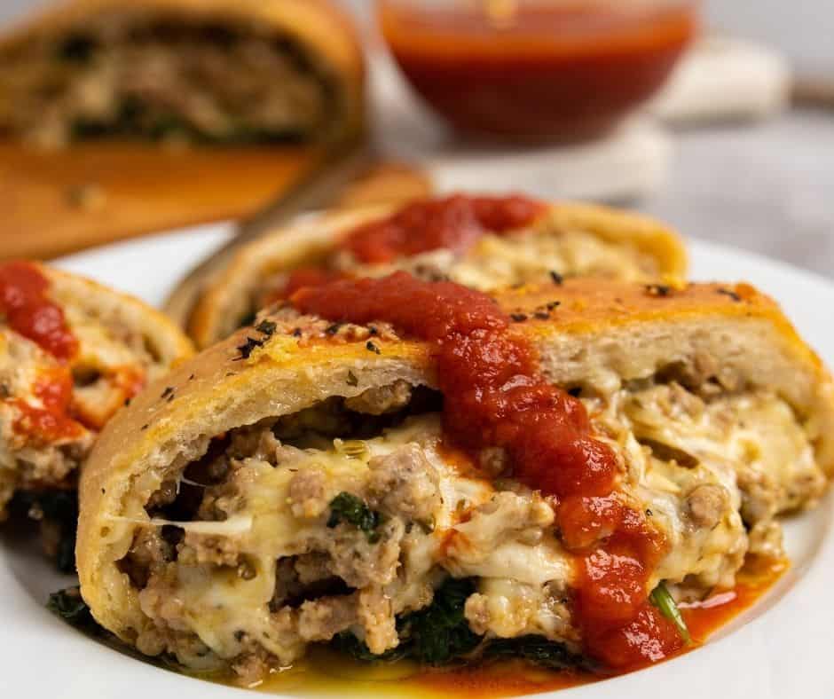 Air Fryer Cheesy Sausage Pizza Bread with melted cheese, sausage, and pizza toppings, served as a savory appetizer.