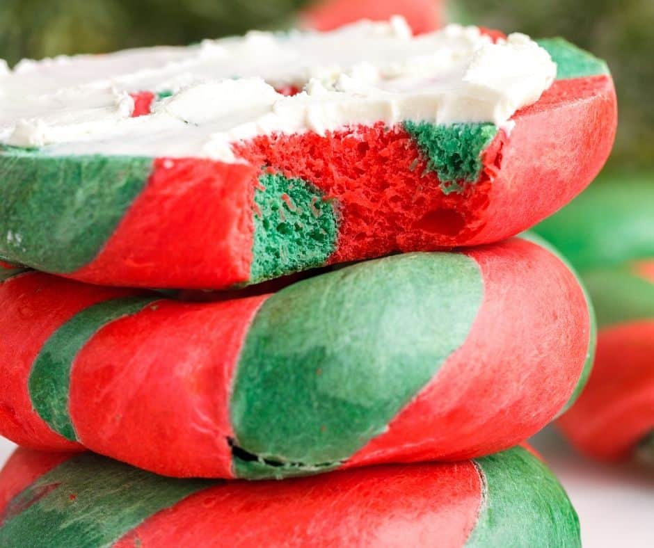 Decorating the air-fried Christmas bagels with festive toppings or icing for a holiday touch