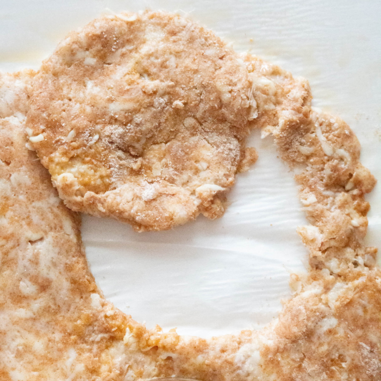 Mixing the dough and rolling out the dough for the biscuits.