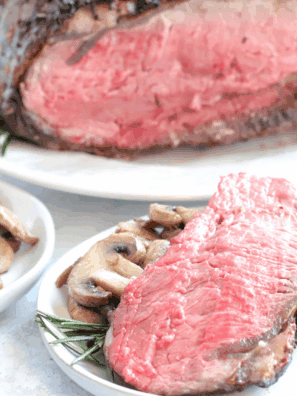 Juicy air fryer prime rib with crispy skin served on a white plate
