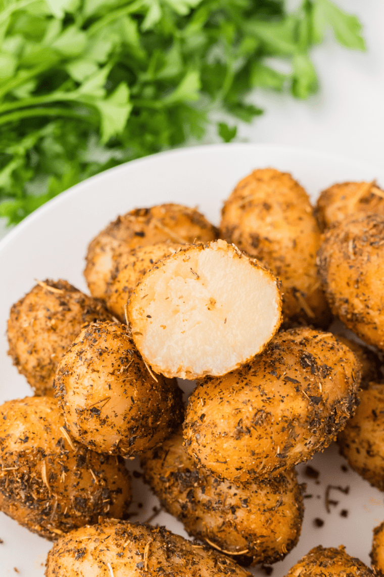 Golden brown and crispy air fryer canned potatoes served on a plate, perfectly seasoned and ready to enjoy.