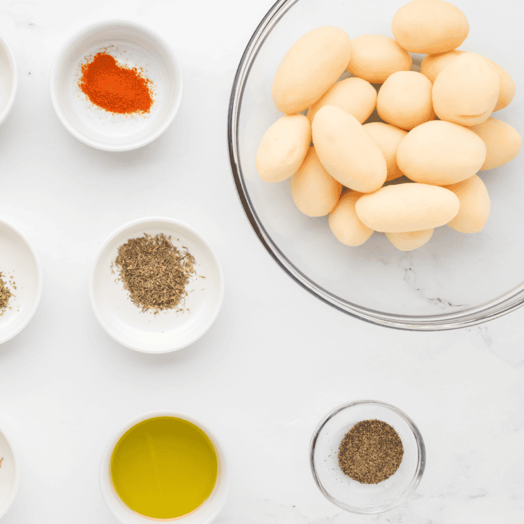 Ingredients needed for Air Fryer Canned Potatoes on kitchen table.