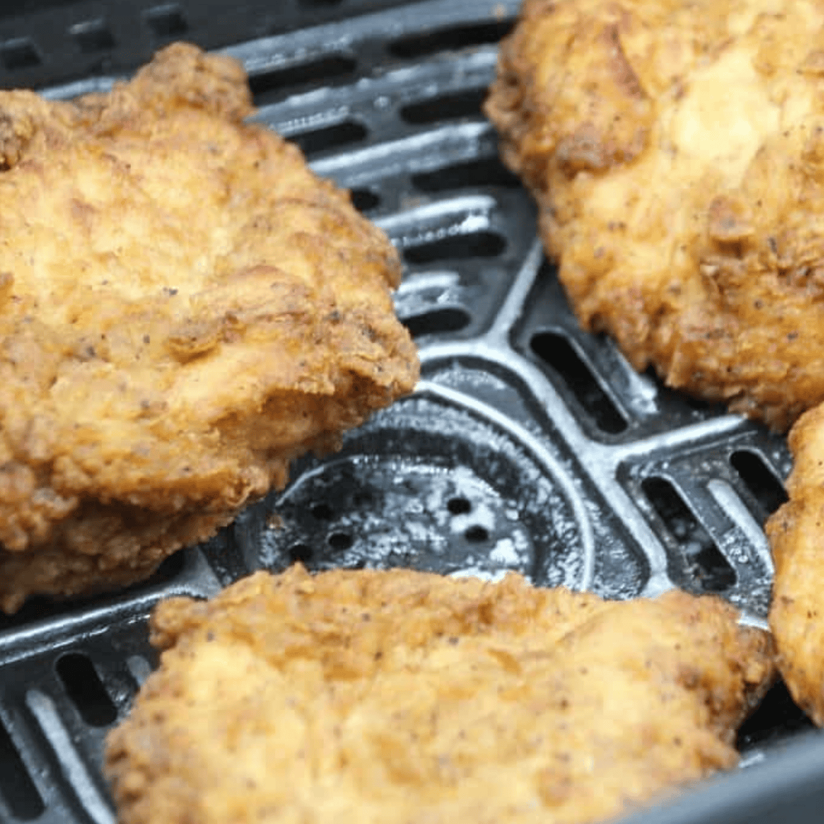 Prepare Southern Fried Chicken and top with Cheddar or American cheese, melting it in the air fryer for a delicious finish.