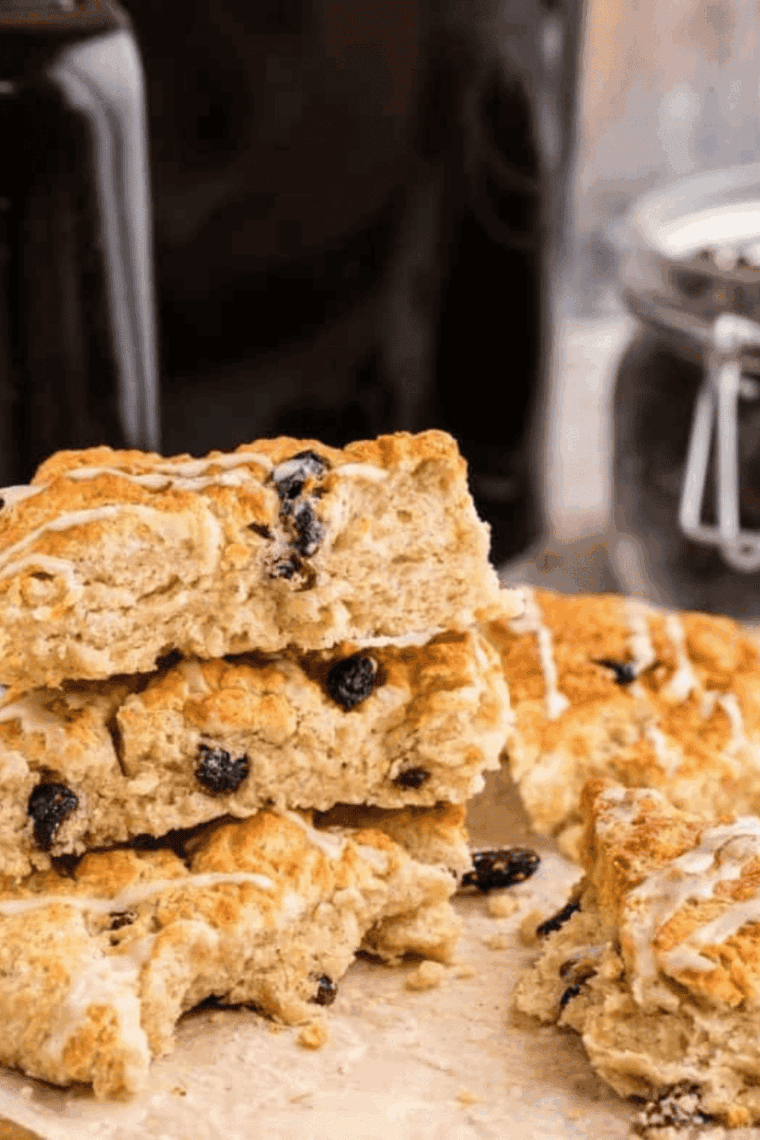 Air Fryer Cinnamon Raisin Scones golden-brown, flaky, and studded with sweet raisins, served on a plate ready to enjoy.