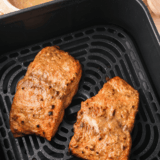 Air fryer copycat Applebee's honey grilled salmon fillet glazed with honey pepper sauce on a white plate