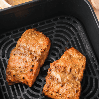 Air fryer copycat Applebee's honey grilled salmon fillet glazed with honey pepper sauce on a white plate