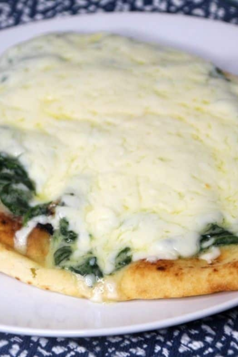 Air Fryer Florentine Flat Bread Pizza topped with spinach, Alfredo sauce, and melted five-cheese blend