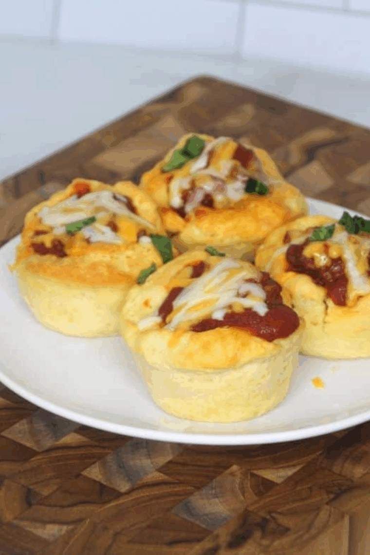 Air fryer Sloppy Joe cups in a muffin tin, filled with savory ground beef and tangy sauce, ready to serve.