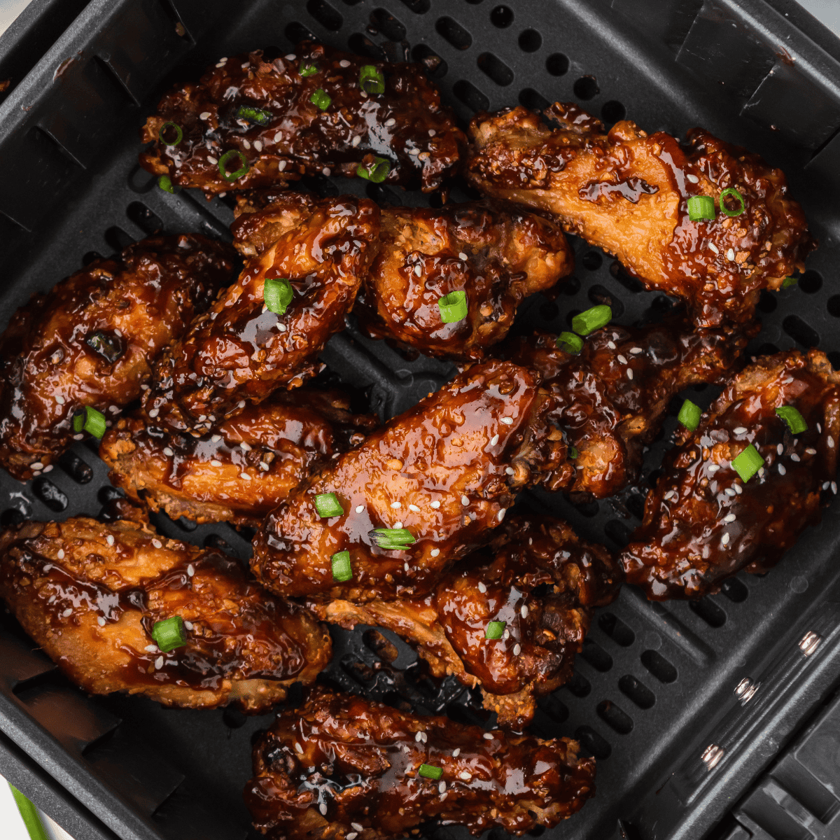 Golden-brown Benihana-style chicken wings served on a plate with dipping sauce.