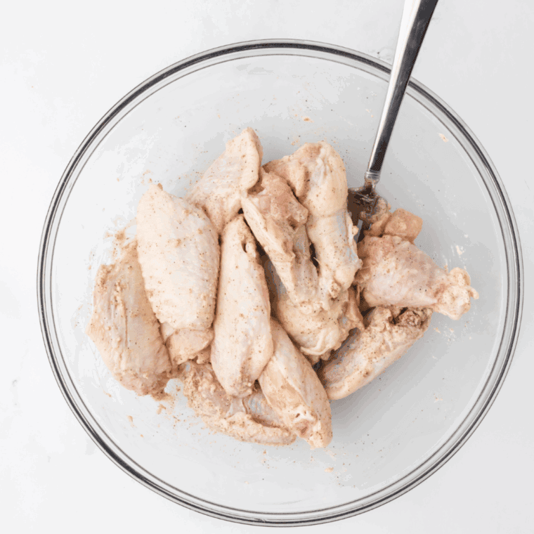 Toss the chicken wings in the seasonings.