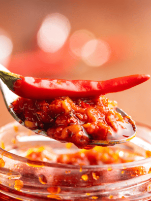 Love the bold, spicy kick of Huy Fong’s Chili Garlic Sauce? Now you can make your own at home! This Homemade Chili Garlic Sauce is packed with fresh chilies, garlic, and tangy vinegar, delivering the perfect balance of heat and flavor. Whether you're stirring it into stir-fries, dipping dumplings, or adding a fiery boost to your favorite dishes, this copycat recipe tastes just like the original—maybe even better!