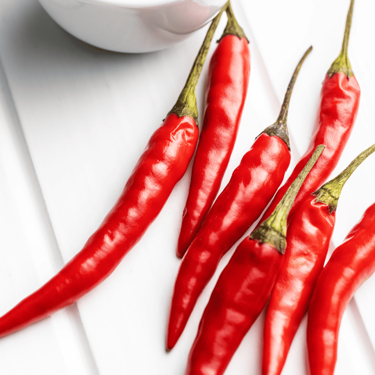Ingredients needed for Homemade Chili Garlic Sauce (Huy Fong Brand Copycat) on kitchen table.