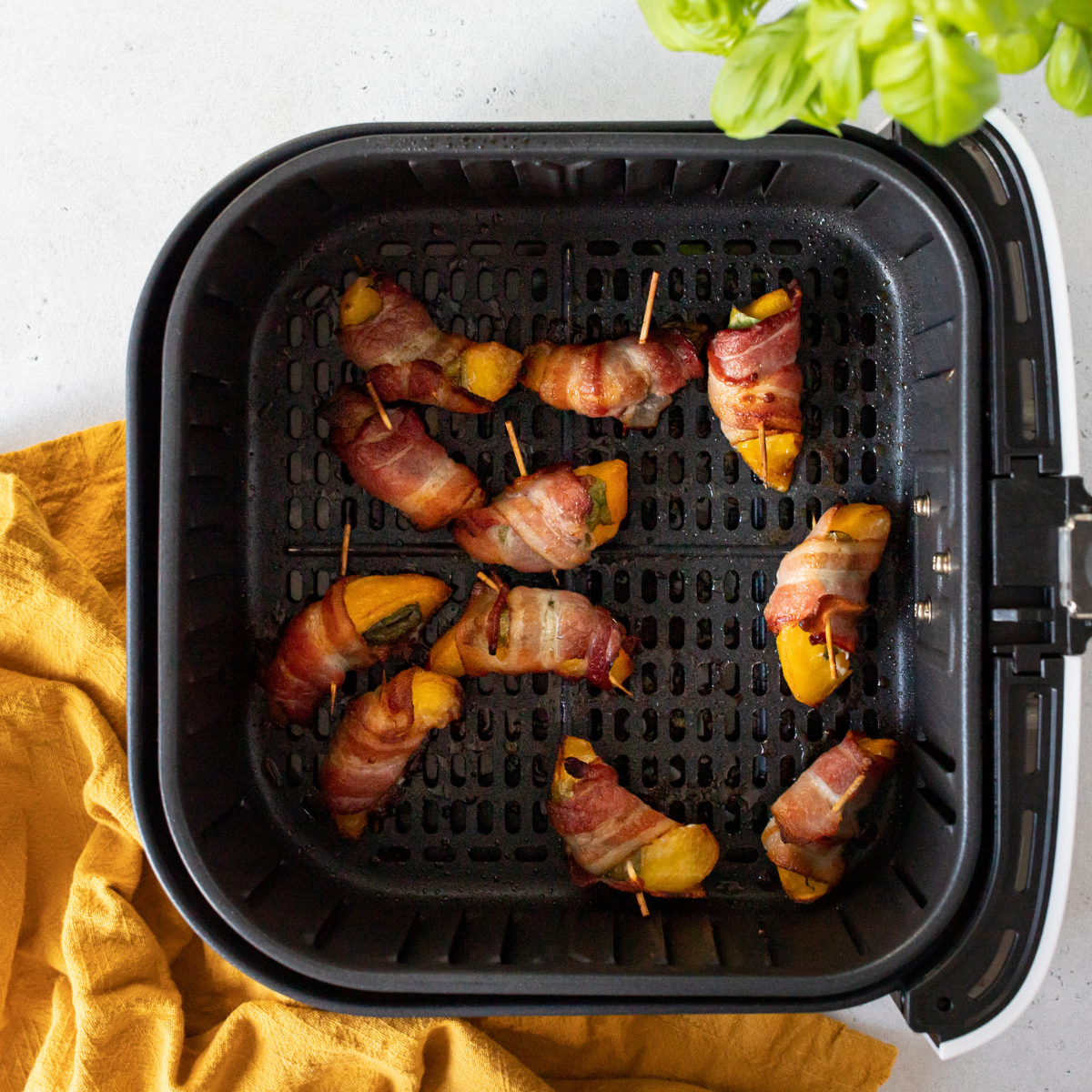 Bacon-wrapped peaches with crispy bacon, ready to be served.