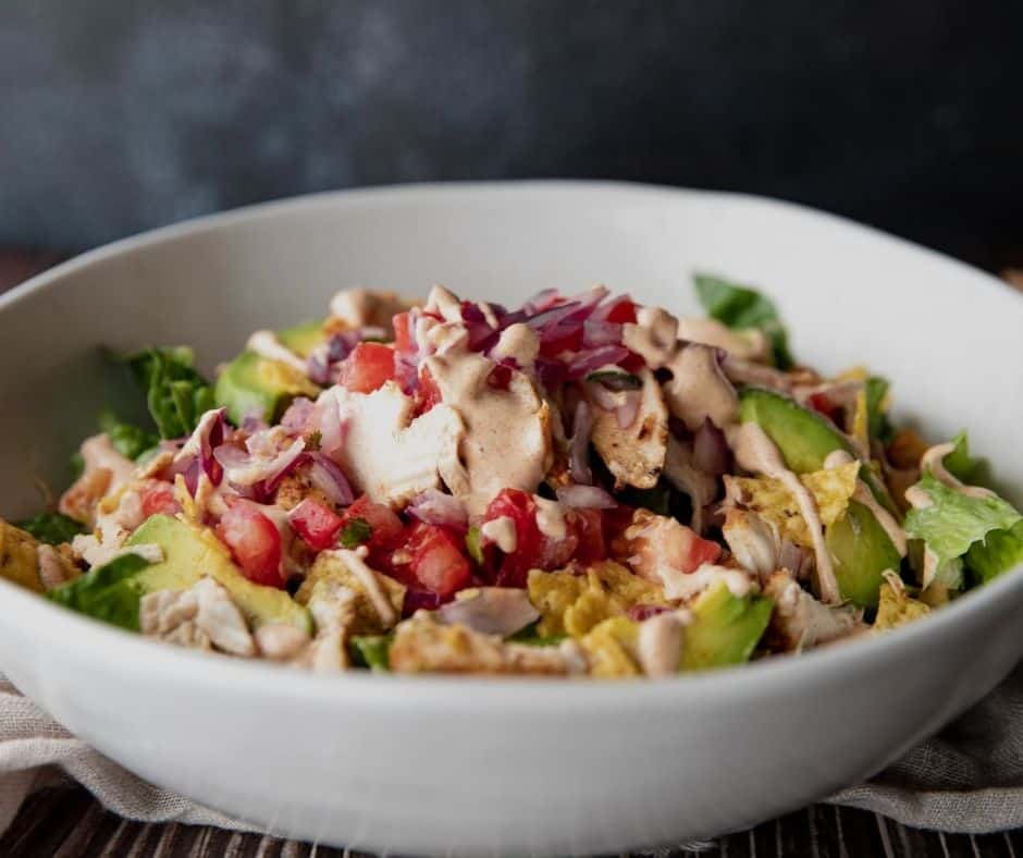 Chili’s Santa Fe Chicken Salad served with a side of dressing.
