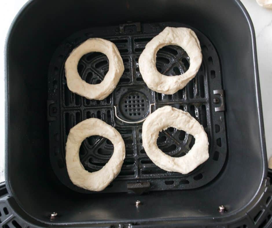 Spray the air fryer basket with cooking spray before adding the biscuit dough.