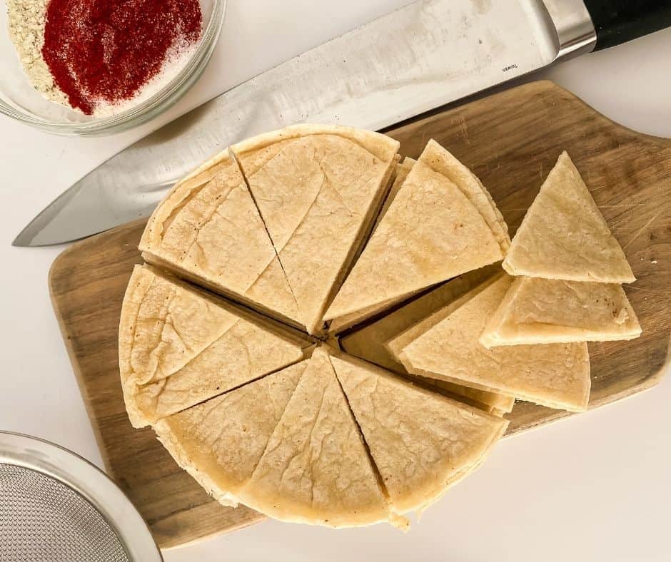 Brushing tortillas with oil, cutting into wedges for chips.