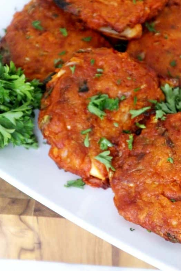 Golden crispy kimchi pancakes cooked in an air fryer, served on a plate
