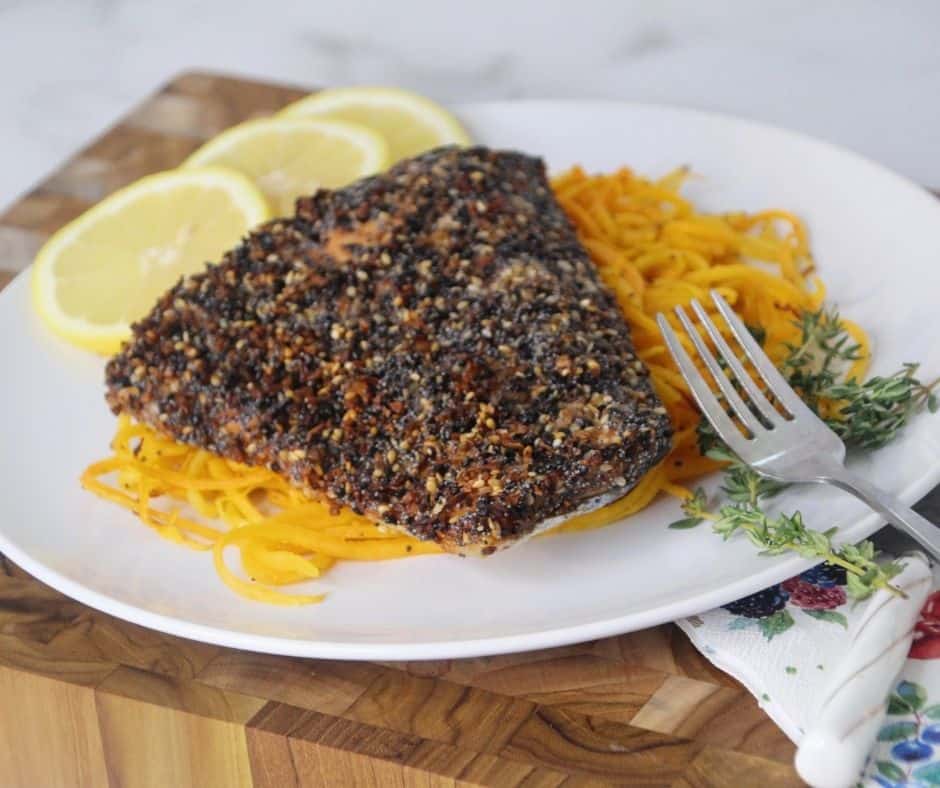 everything bagel crusted salmon served with spaghetti squash and lemon slices
