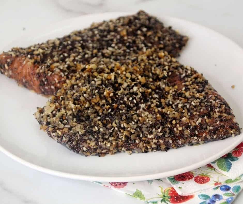 two everything bagel crusted salmon fillets on a plate