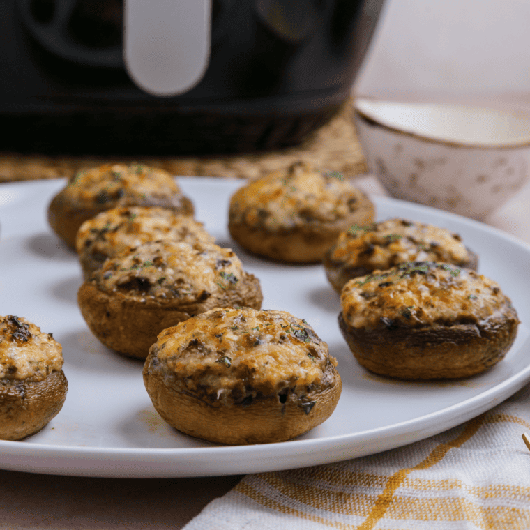 Close-up of copycat Longhorn stuffed mushrooms with a golden crispy top and melted cheese
