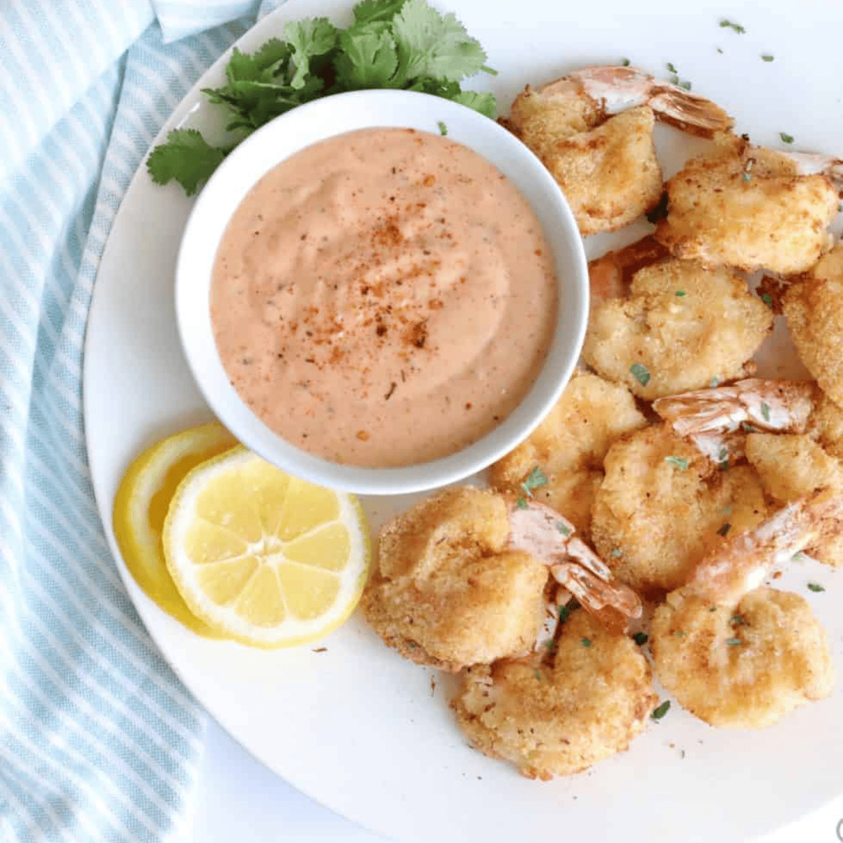 Golden, crispy Air Fryer Beer Battered Shrimp served with dipping sauce, perfect for a delicious seafood appetizer or main dish