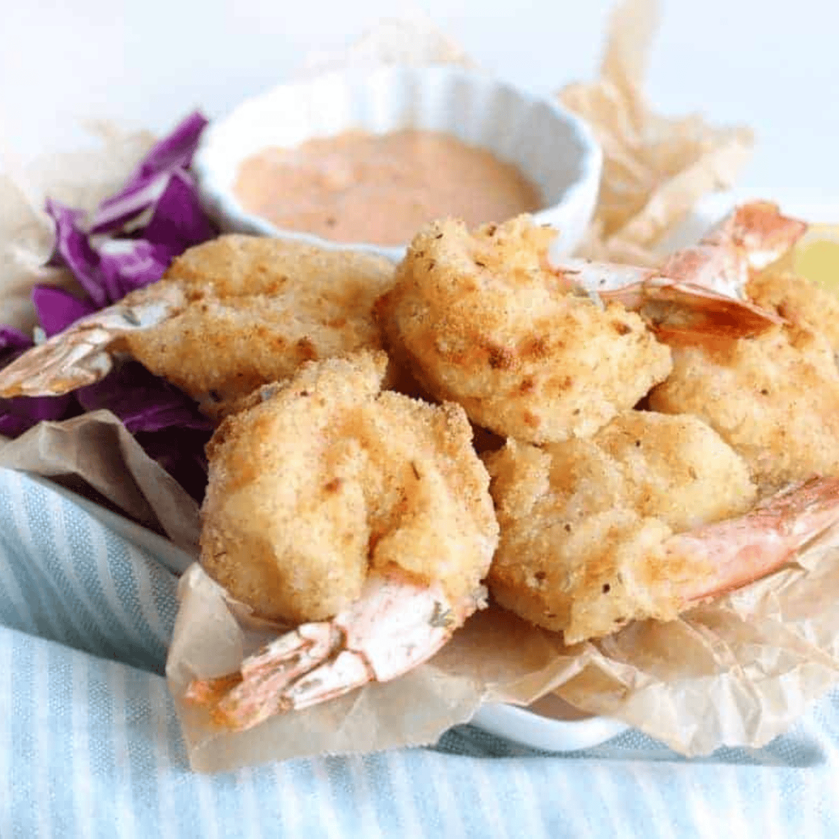 Golden, crispy shrimp coated in a beer batter, cooked in the air fryer, served as a flavorful appetizer or main dish.
