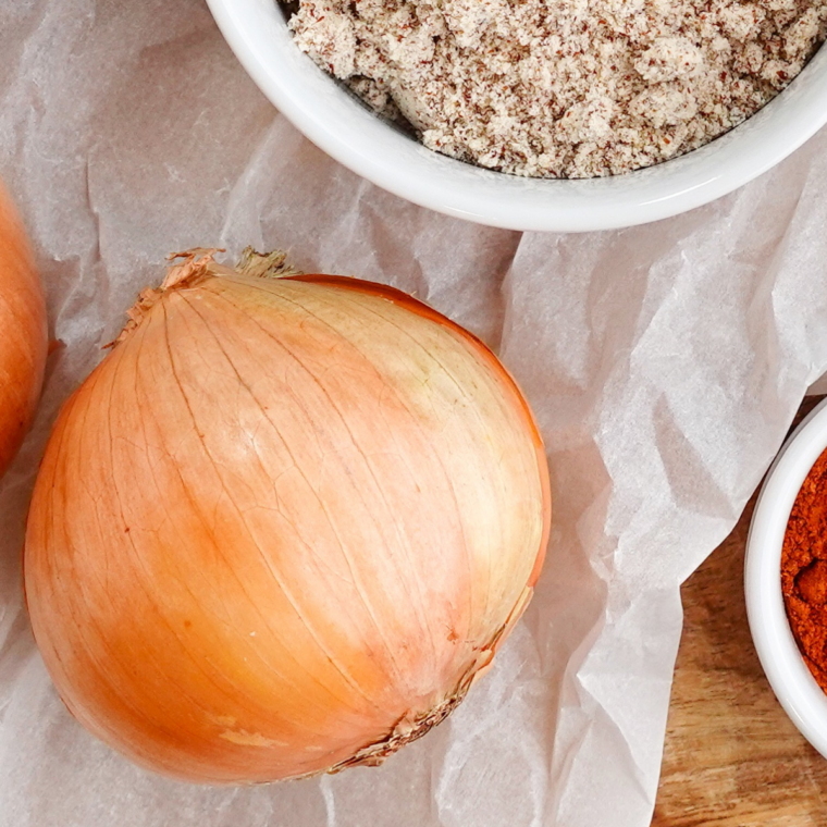 Ingredients for air fryer caramelized onions: sliced sweet onions, butter, olive oil, kosher salt, and balsamic vinegar