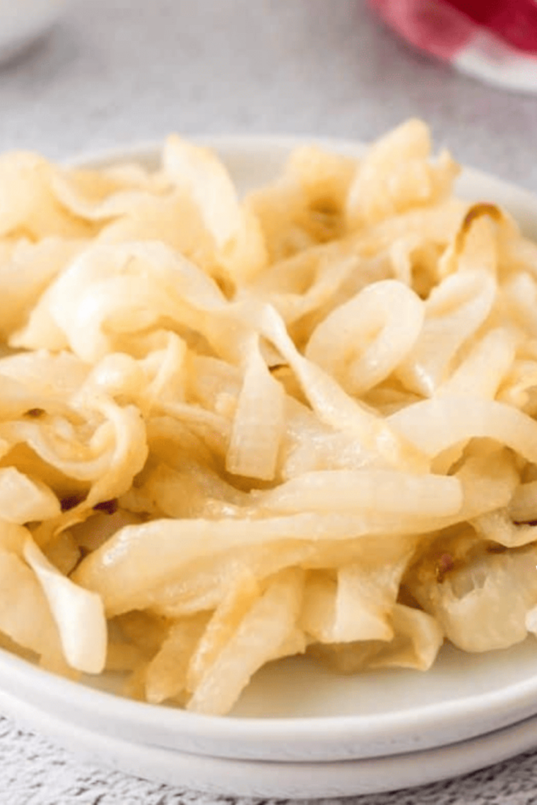 Close-up plate of soft golden caramelized onions made in the air fryer