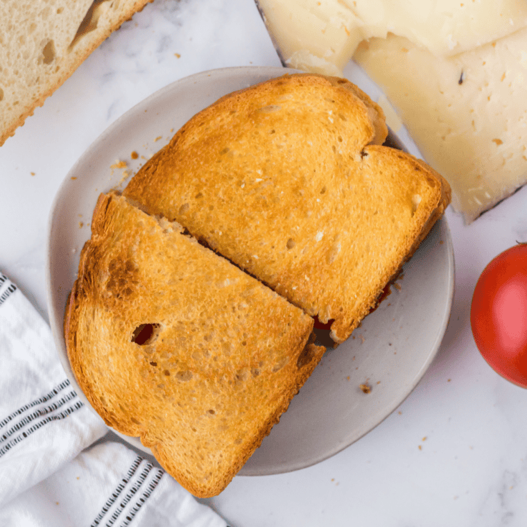 Air Fryer Spanish Manchego Grilled Cheese with golden crispy bread and melted manchego cheese inside