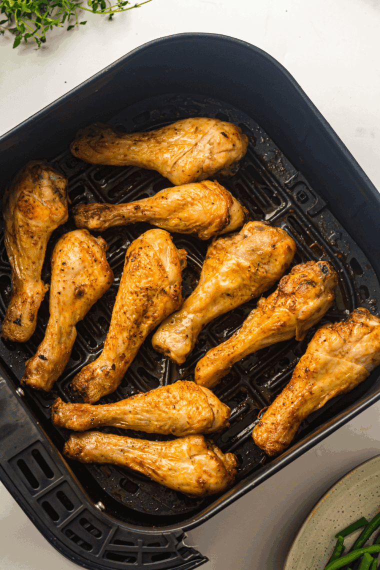 Crispy air fryer garlic Parmesan chicken drumsticks served on a plate with golden-brown skin
