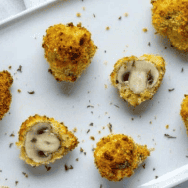 Golden and crispy fried mushrooms inspired by Logan's Roadhouse recipe, ready to serve as an irresistible appetizer.