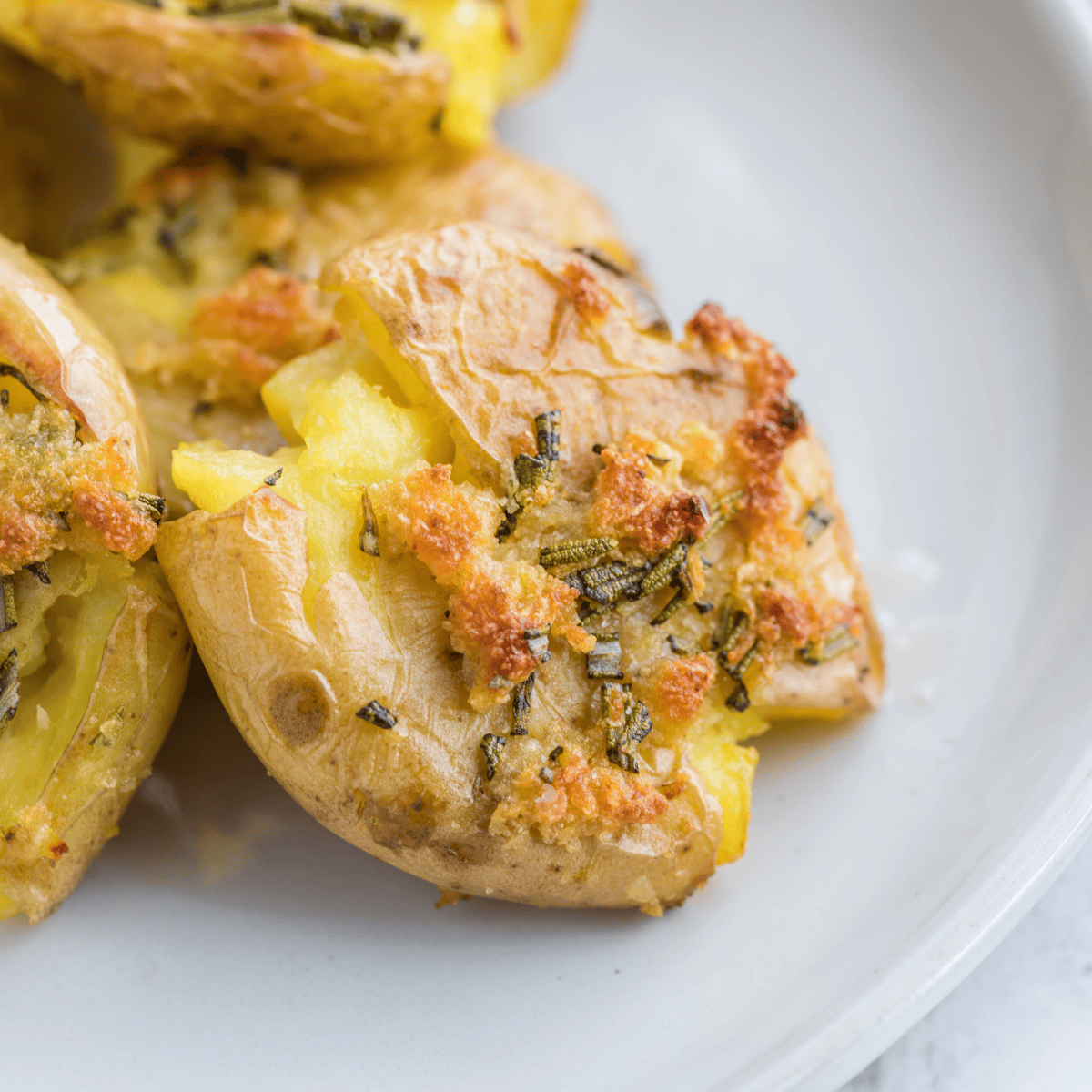 Recreate Logan’s Roadhouse Fried Smashed Potatoes at home! Crispy on the outside.