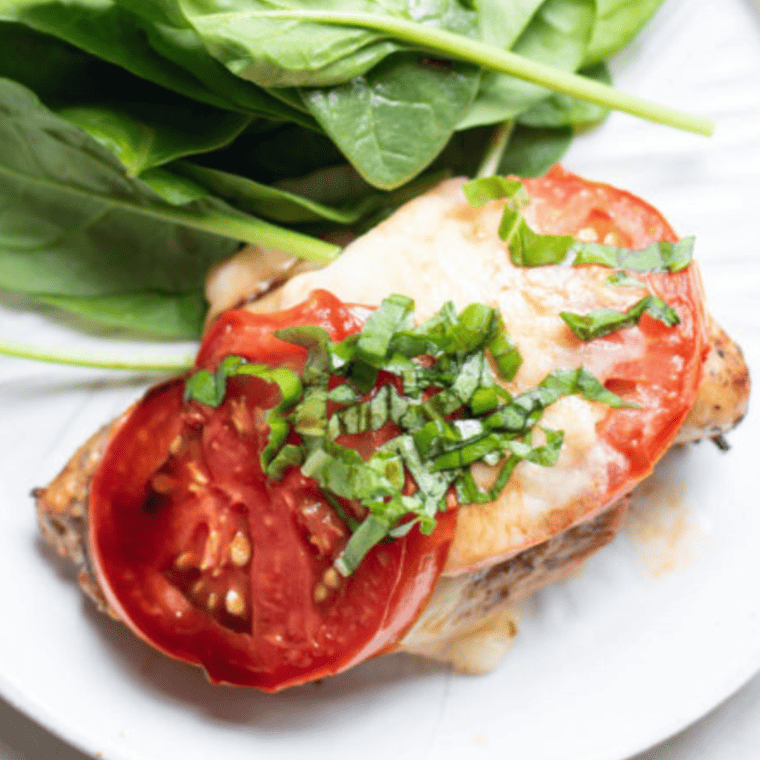 Juicy air fryer caprese chicken sliced to show the tender inside