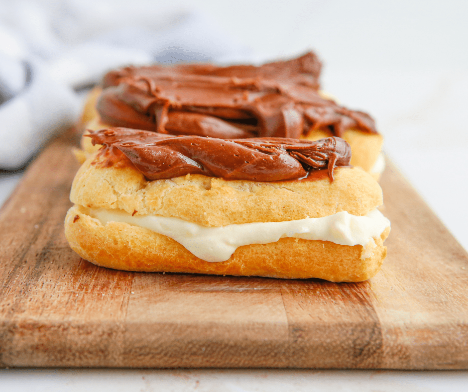 Air Fryer Eclairs with chocolate frosting and vanilla custard filling.
